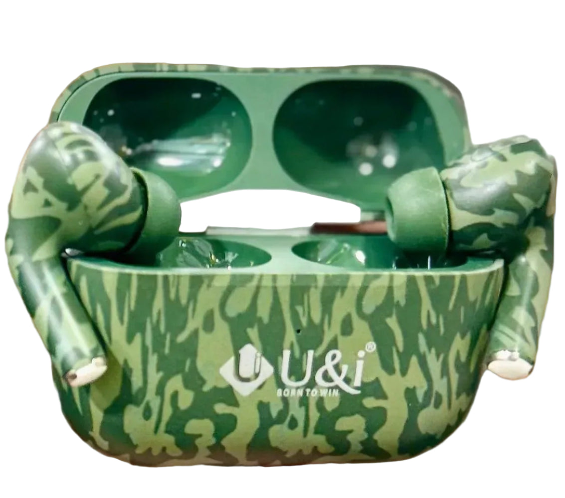 Green patterned wireless earbuds case held by a person in a blurred indoor setting